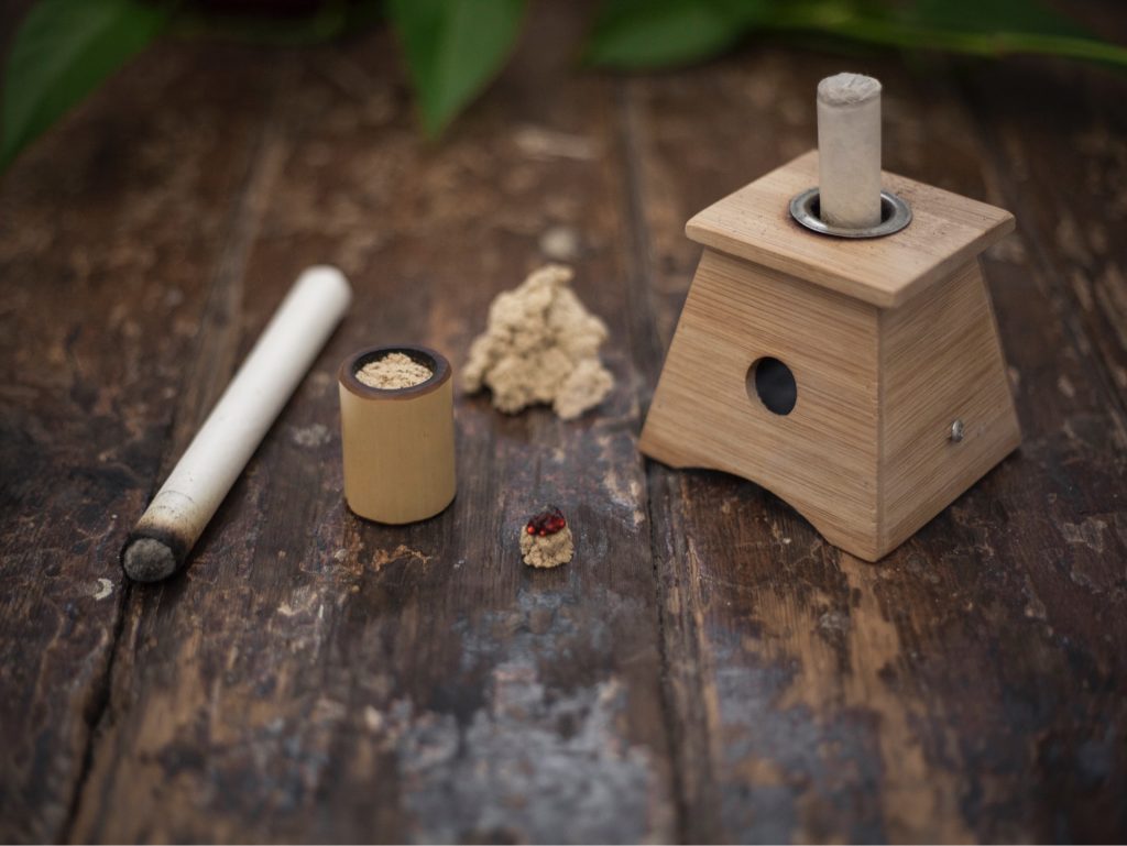 Moxibustion burning to activate the parasympathetic nervous system.